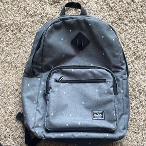 grey polka dot backpack